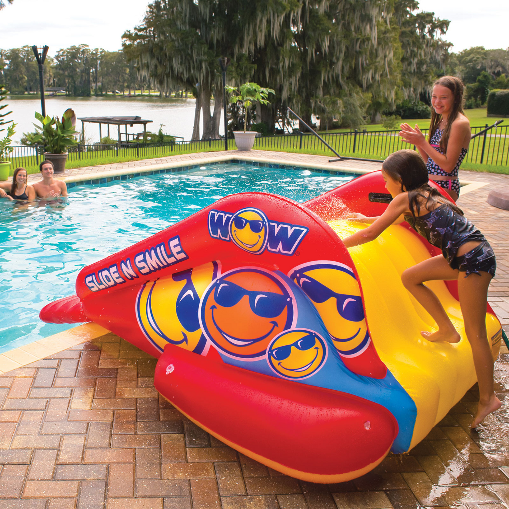 WOW Sports Slide N Smile Inflatable Pool Slide with Sprinklers for