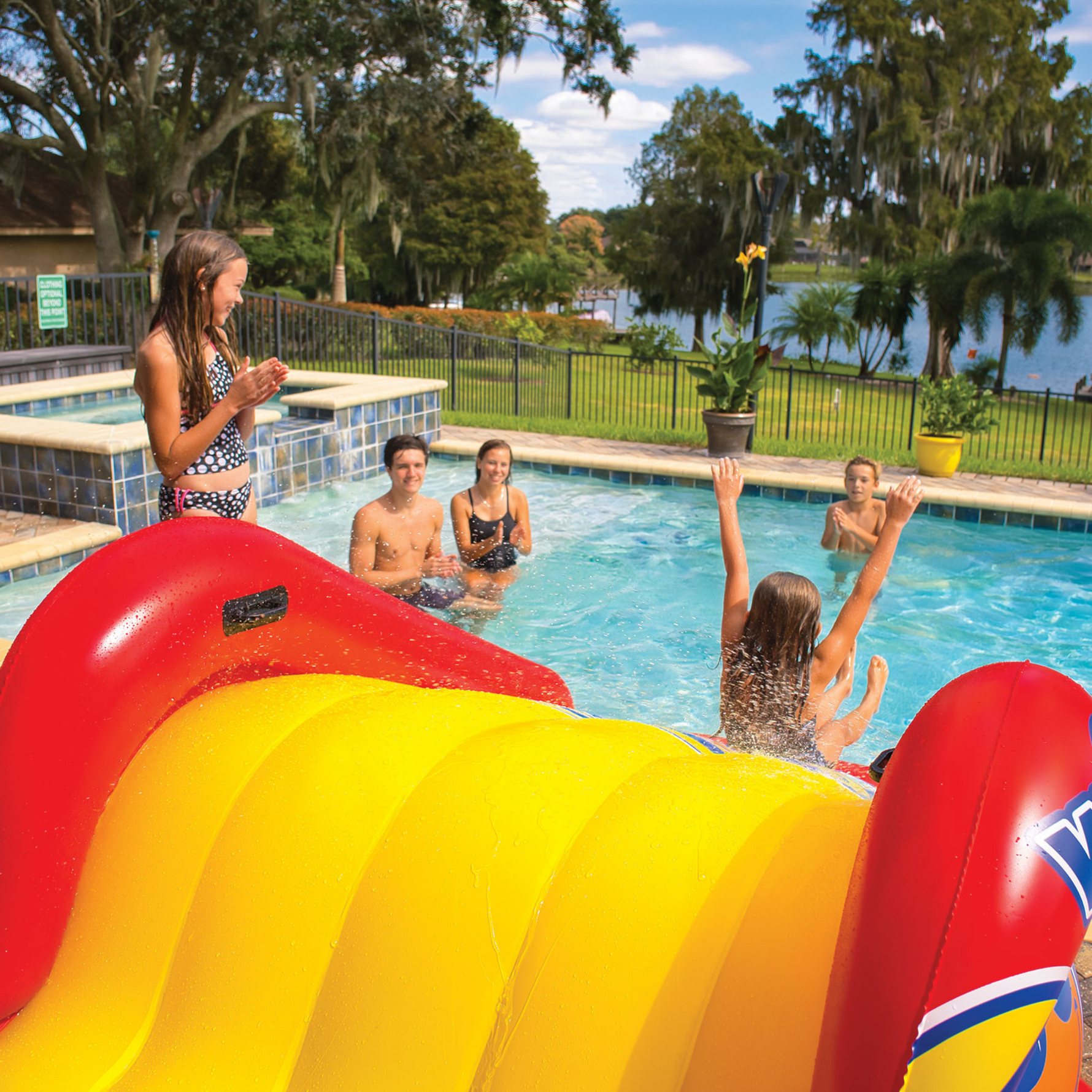 WOW Sports Slide N Smile Inflatable Pool Slide with Sprinklers for