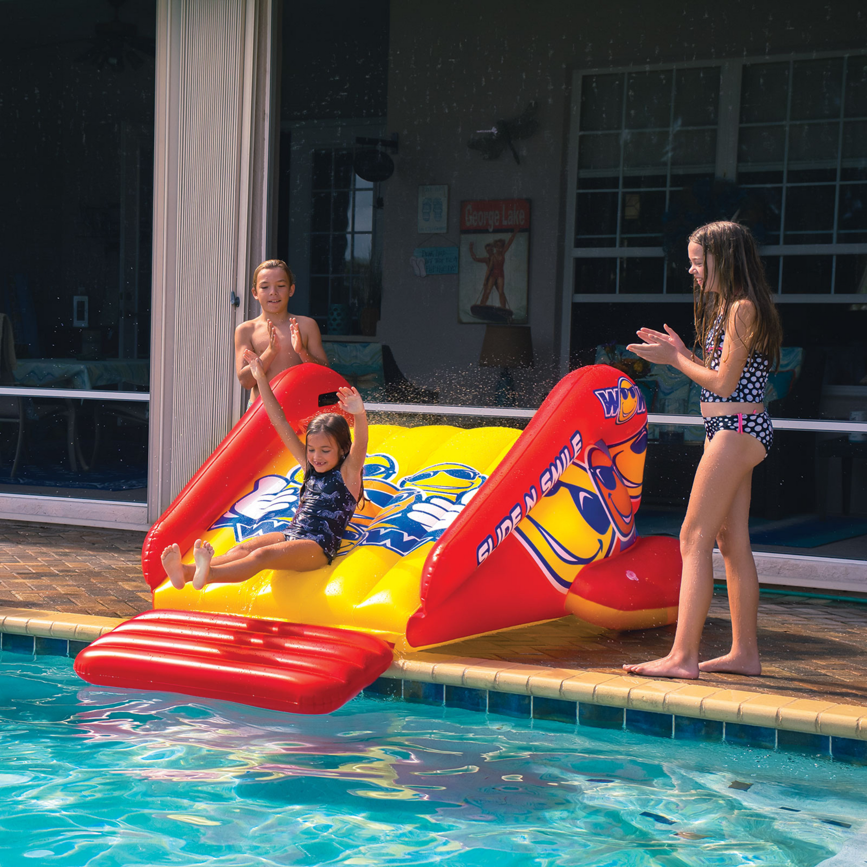 WOW Sports Slide N Smile Inflatable Pool Slide with Sprinklers for
