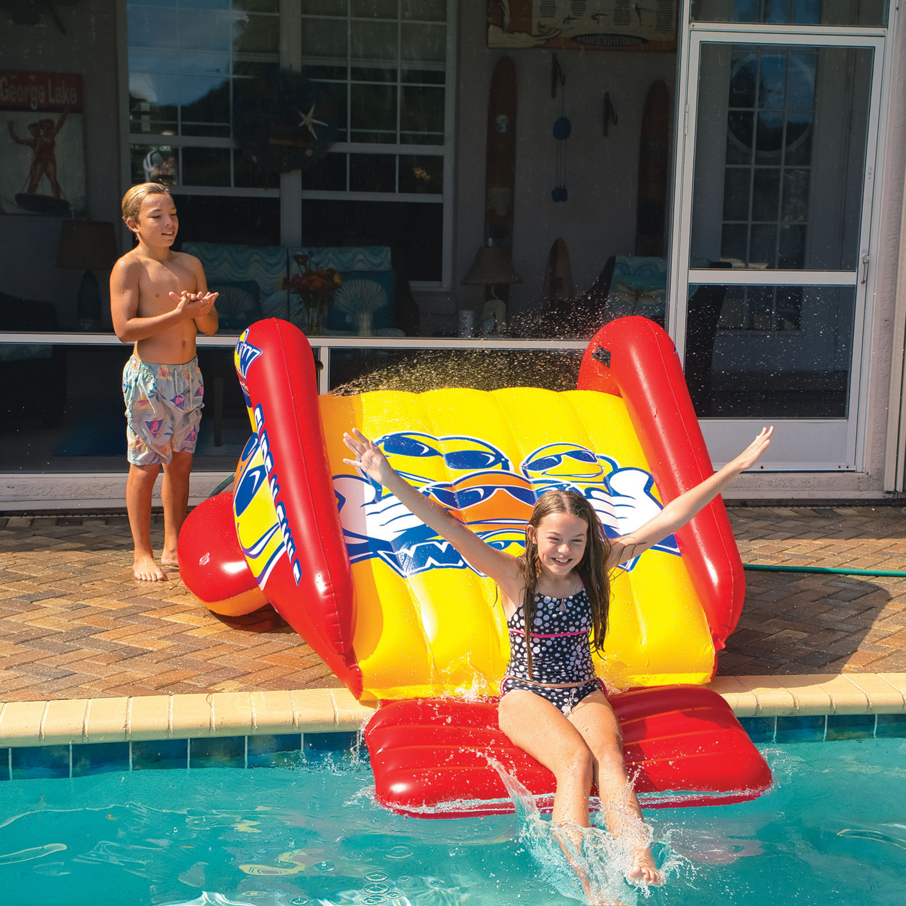 WOW Sports Slide N Smile Inflatable Pool Slide with Sprinklers for
