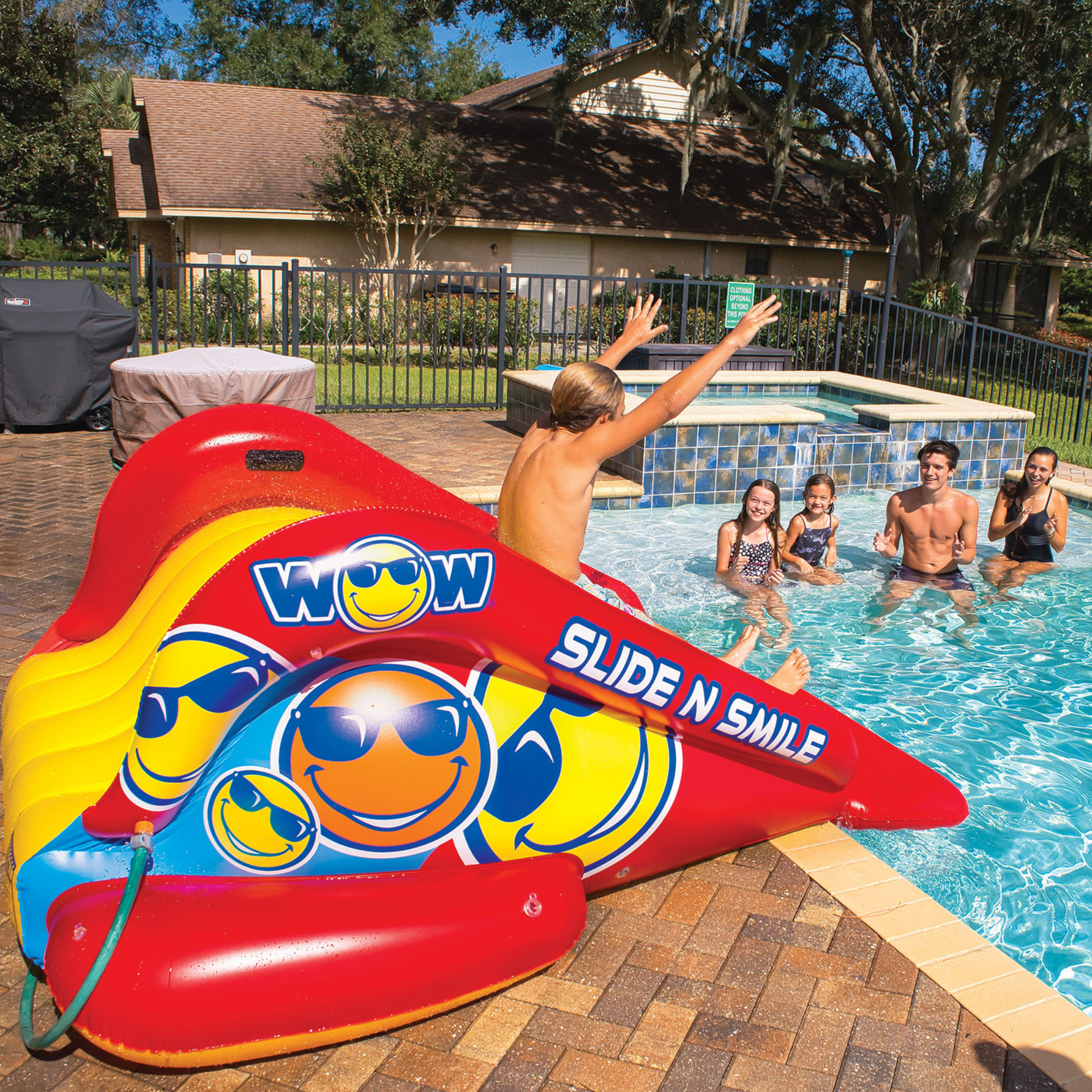 WOW Sports Slide N Smile Inflatable Pool Slide with Sprinklers for