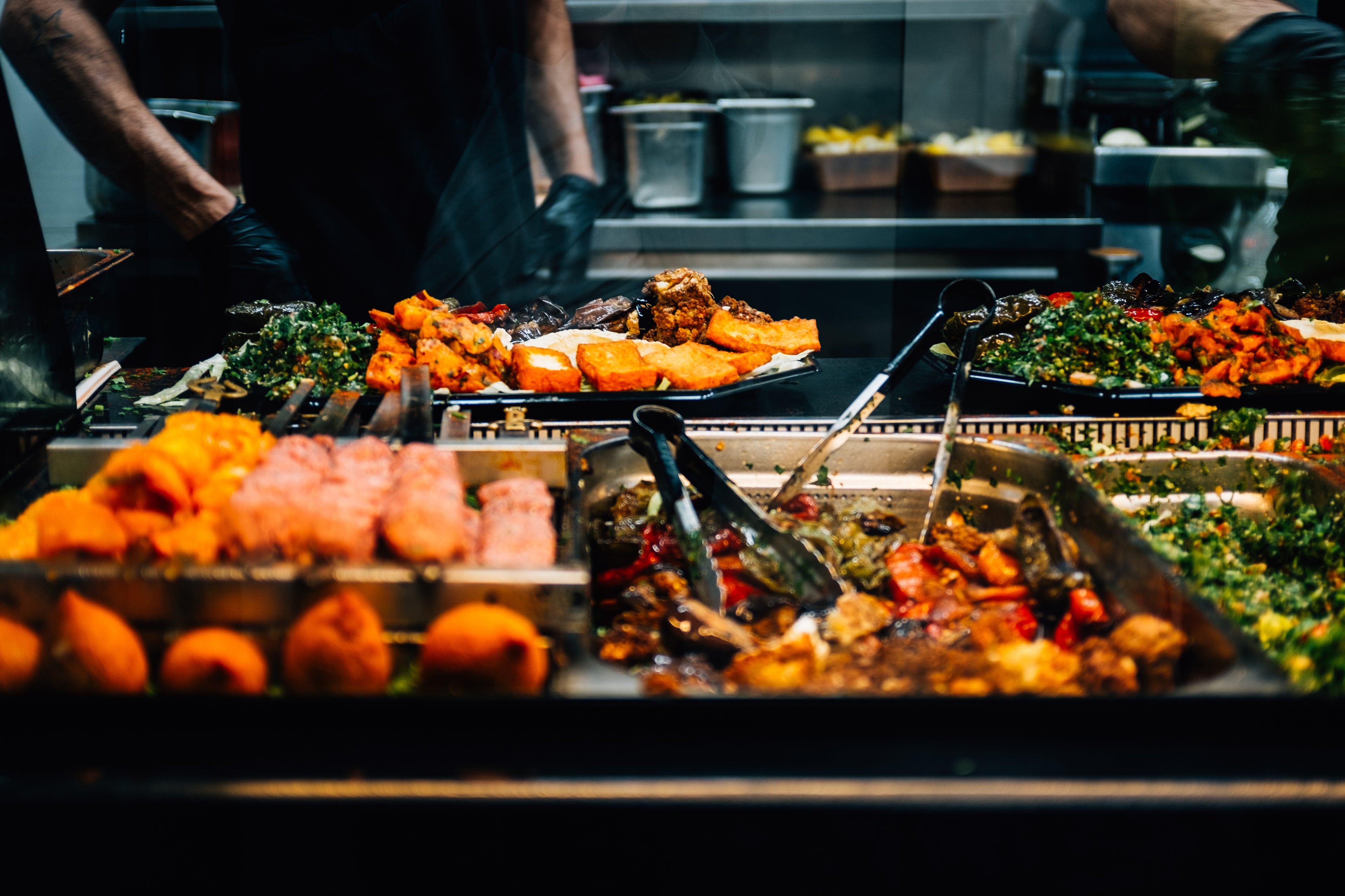files/trays-of-colorful-food-with-tongs.jpg